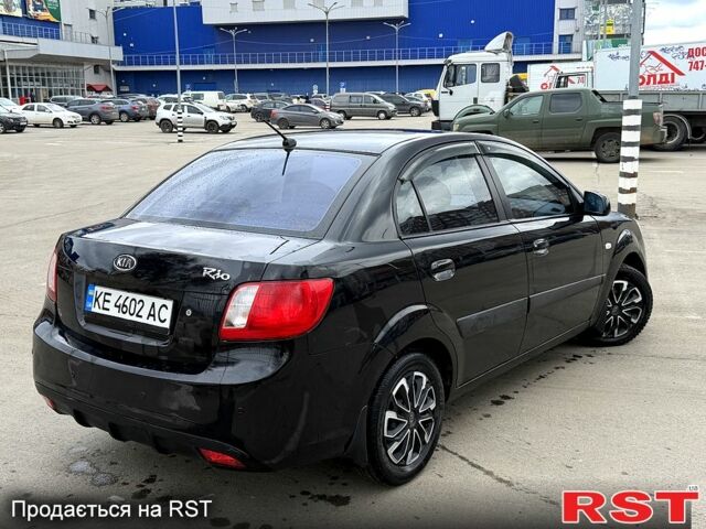 Чорний Кіа Ріо, об'ємом двигуна 1.4 л та пробігом 220 тис. км за 4700 $, фото 5 на Automoto.ua