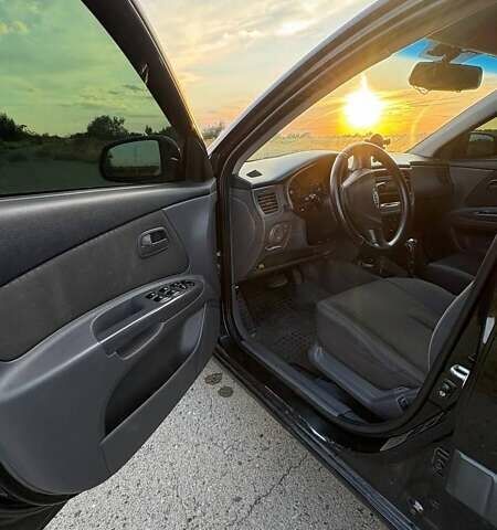 Черный Киа Рио, объемом двигателя 1.4 л и пробегом 168 тыс. км за 5600 $, фото 17 на Automoto.ua