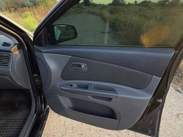 Чорний Кіа Ріо, об'ємом двигуна 1.4 л та пробігом 168 тис. км за 5500 $, фото 9 на Automoto.ua