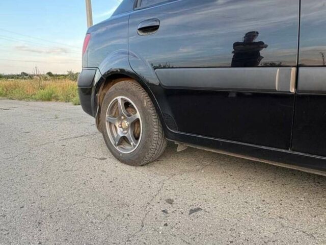 Чорний Кіа Ріо, об'ємом двигуна 1.4 л та пробігом 168 тис. км за 5500 $, фото 7 на Automoto.ua