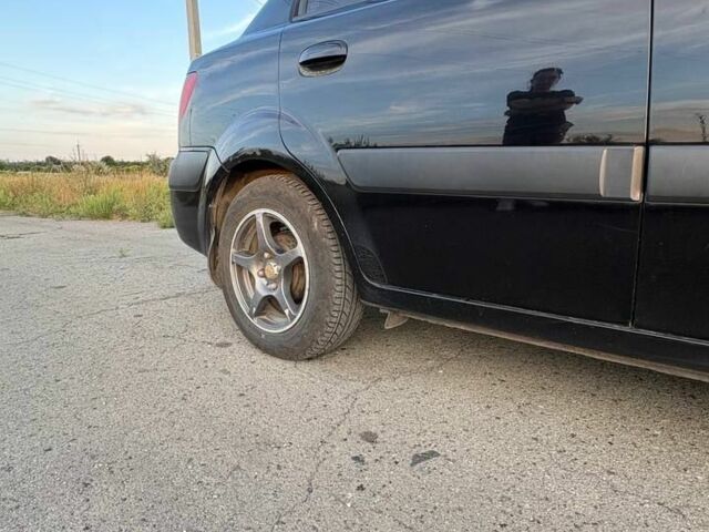 Черный Киа Рио, объемом двигателя 1.4 л и пробегом 168 тыс. км за 5500 $, фото 7 на Automoto.ua