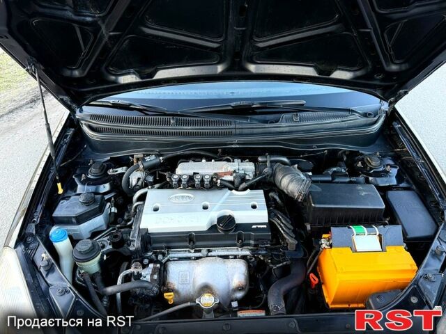 Чорний Кіа Ріо, об'ємом двигуна 1.4 л та пробігом 224 тис. км за 4999 $, фото 7 на Automoto.ua