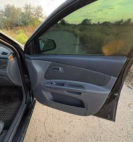 Черный Киа Рио, объемом двигателя 1.4 л и пробегом 168 тыс. км за 5600 $, фото 12 на Automoto.ua