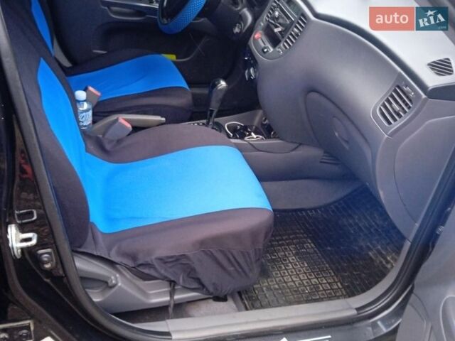 Черный Киа Рио, объемом двигателя 1.4 л и пробегом 168 тыс. км за 5600 $, фото 18 на Automoto.ua