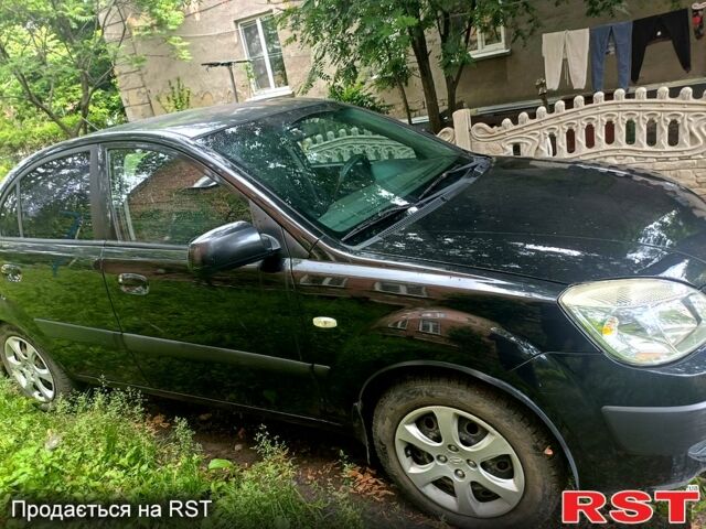 Черный Киа Рио, объемом двигателя 1.4 л и пробегом 260 тыс. км за 3900 $, фото 1 на Automoto.ua
