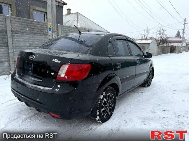Чорний Кіа Ріо, об'ємом двигуна 1.4 л та пробігом 167 тис. км за 5550 $, фото 1 на Automoto.ua