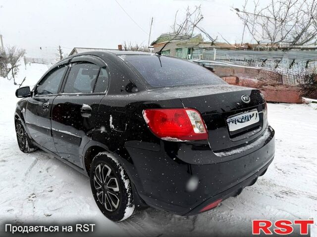 Чорний Кіа Ріо, об'ємом двигуна 1.4 л та пробігом 167 тис. км за 5550 $, фото 2 на Automoto.ua