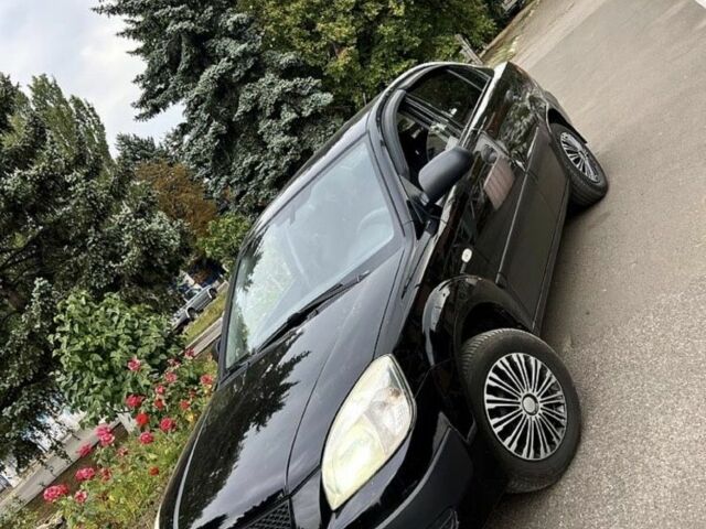 Черный Киа Рио, объемом двигателя 1.4 л и пробегом 252 тыс. км за 3889 $, фото 2 на Automoto.ua