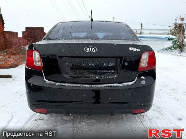 Чорний Кіа Ріо, об'ємом двигуна 1.4 л та пробігом 167 тис. км за 5550 $, фото 3 на Automoto.ua