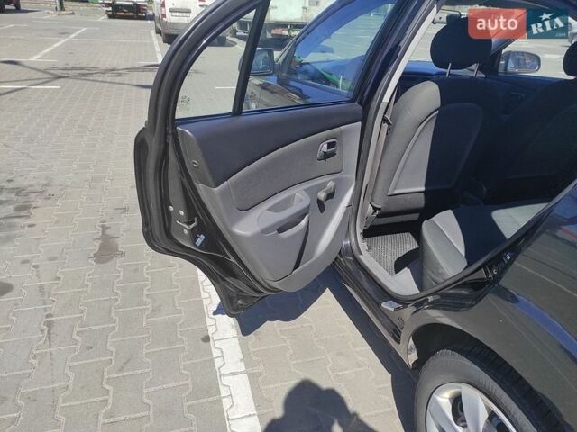 Чорний Кіа Ріо, об'ємом двигуна 1.4 л та пробігом 200 тис. км за 5500 $, фото 11 на Automoto.ua