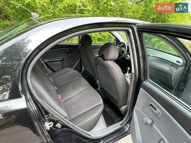 Черный Киа Рио, объемом двигателя 1.4 л и пробегом 91 тыс. км за 4800 $, фото 12 на Automoto.ua