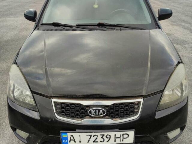 Чорний Кіа Ріо, об'ємом двигуна 1.4 л та пробігом 253 тис. км за 4000 $, фото 1 на Automoto.ua