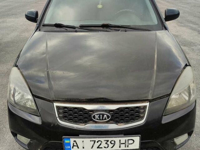 Черный Киа Рио, объемом двигателя 1.4 л и пробегом 253 тыс. км за 4000 $, фото 1 на Automoto.ua