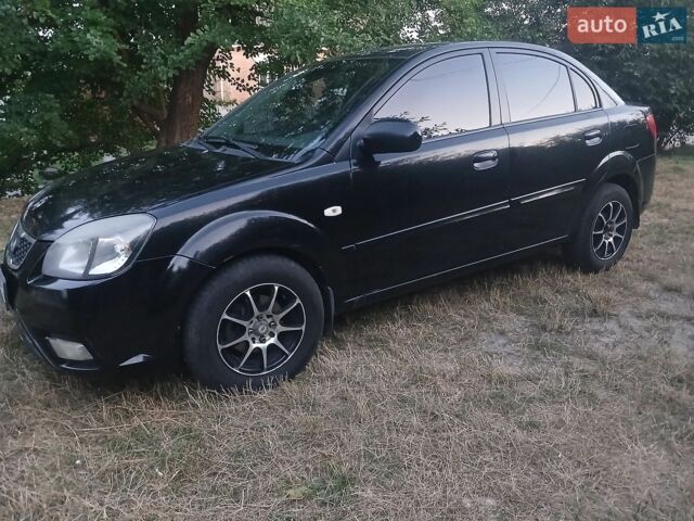Чорний Кіа Ріо, об'ємом двигуна 1.4 л та пробігом 210 тис. км за 4700 $, фото 1 на Automoto.ua