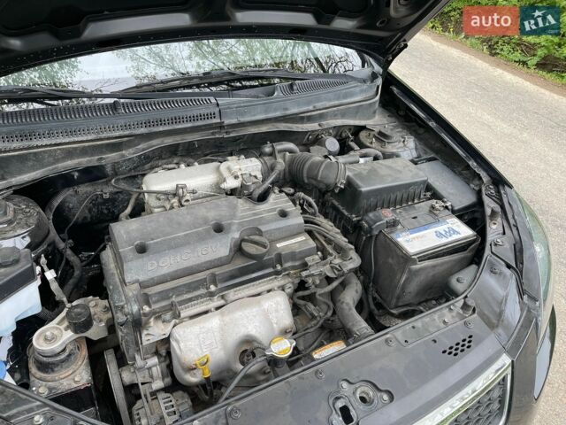 Черный Киа Рио, объемом двигателя 1.4 л и пробегом 91 тыс. км за 4500 $, фото 23 на Automoto.ua