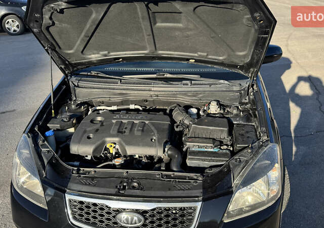 Чорний Кіа Ріо, об'ємом двигуна 1.5 л та пробігом 154 тис. км за 6900 $, фото 26 на Automoto.ua