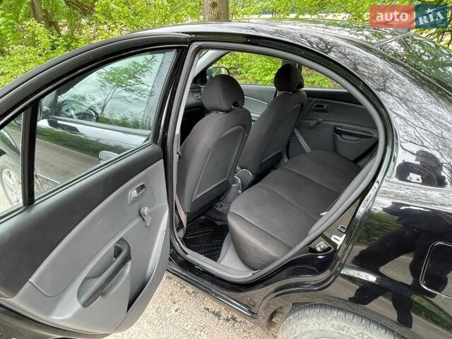 Черный Киа Рио, объемом двигателя 1.4 л и пробегом 91 тыс. км за 4500 $, фото 6 на Automoto.ua