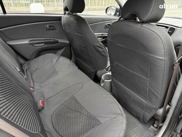 Чорний Кіа Ріо, об'ємом двигуна 1.4 л та пробігом 151 тис. км за 6490 $, фото 38 на Automoto.ua