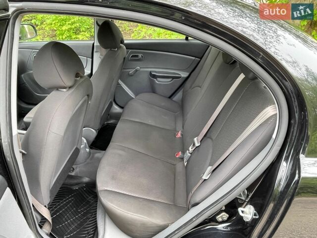 Черный Киа Рио, объемом двигателя 1.4 л и пробегом 91 тыс. км за 4500 $, фото 4 на Automoto.ua