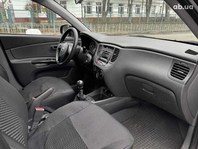 Чорний Кіа Ріо, об'ємом двигуна 1.4 л та пробігом 151 тис. км за 6490 $, фото 36 на Automoto.ua