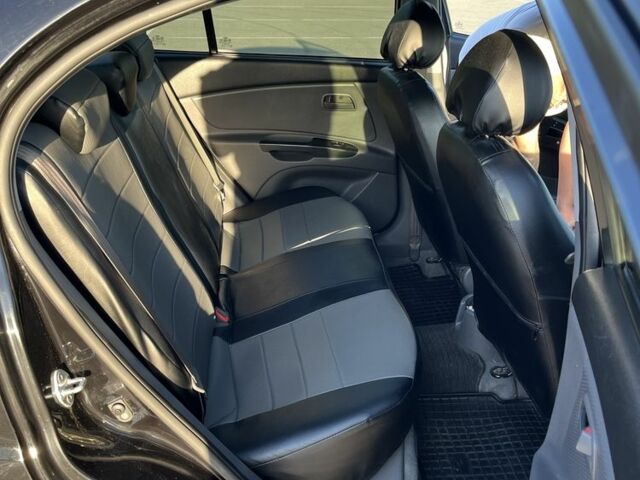 Черный Киа Рио, объемом двигателя 1.4 л и пробегом 140 тыс. км за 5500 $, фото 6 на Automoto.ua