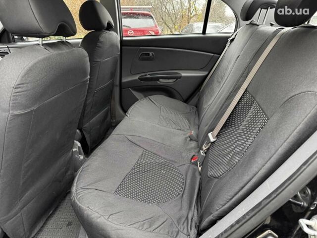 Чорний Кіа Ріо, об'ємом двигуна 1.4 л та пробігом 151 тис. км за 6490 $, фото 21 на Automoto.ua