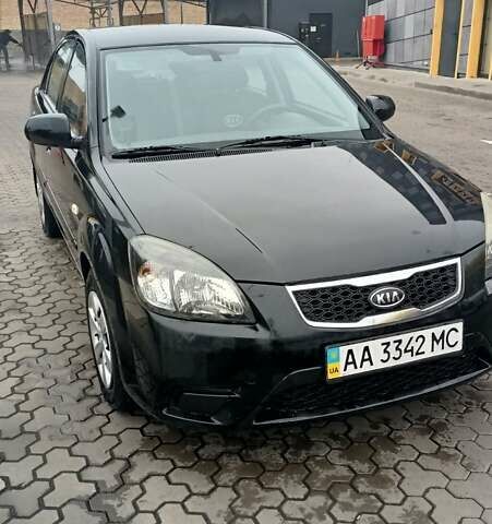 Черный Киа Рио, объемом двигателя 1.4 л и пробегом 150 тыс. км за 6000 $, фото 2 на Automoto.ua