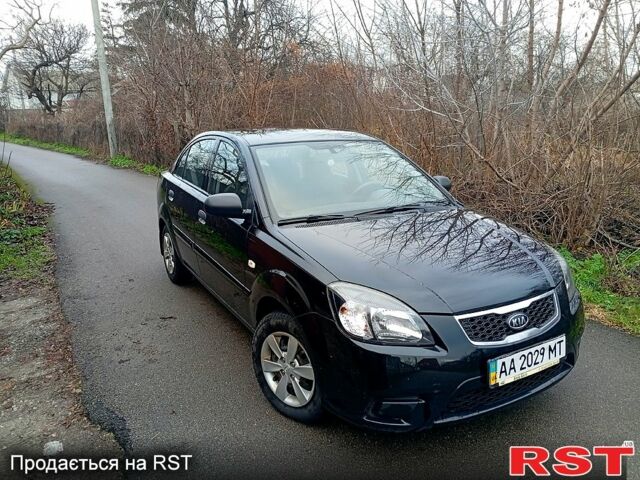 Чорний Кіа Ріо, об'ємом двигуна 1.4 л та пробігом 186 тис. км за 4800 $, фото 3 на Automoto.ua