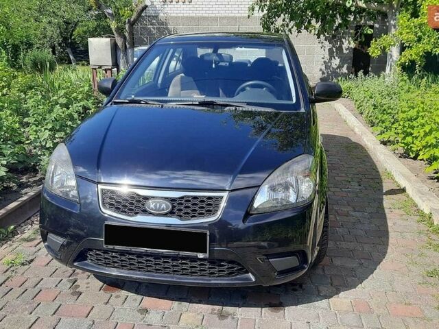 Чорний Кіа Ріо, об'ємом двигуна 1.4 л та пробігом 140 тис. км за 5200 $, фото 2 на Automoto.ua
