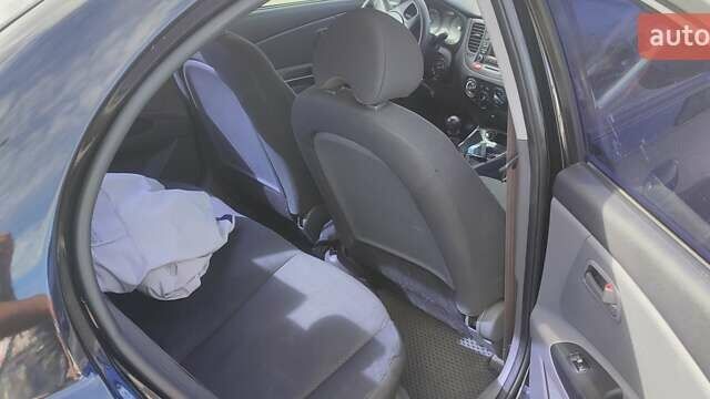 Черный Киа Рио, объемом двигателя 1.4 л и пробегом 224 тыс. км за 4600 $, фото 2 на Automoto.ua