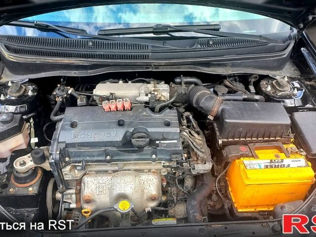 Черный Киа Рио, объемом двигателя 1.4 л и пробегом 49 тыс. км за 4800 $, фото 8 на Automoto.ua