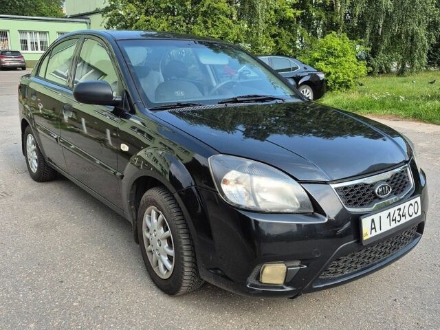 Чорний Кіа Ріо, об'ємом двигуна 1.4 л та пробігом 244 тис. км за 4700 $, фото 3 на Automoto.ua