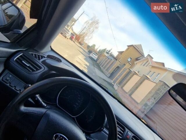 Чорний Кіа Ріо, об'ємом двигуна 1.4 л та пробігом 180 тис. км за 6450 $, фото 1 на Automoto.ua
