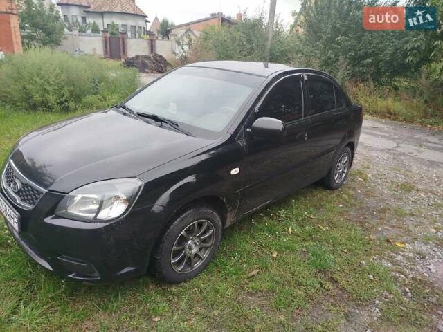 Черный Киа Рио, объемом двигателя 1.4 л и пробегом 133 тыс. км за 5900 $, фото 1 на Automoto.ua