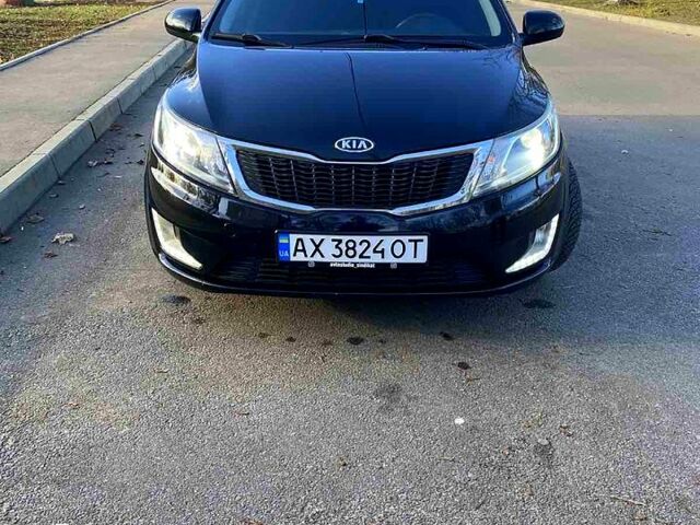 Чорний Кіа Ріо, об'ємом двигуна 1.4 л та пробігом 1350 тис. км за 7100 $, фото 3 на Automoto.ua