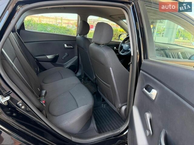 Чорний Кіа Ріо, об'ємом двигуна 1.4 л та пробігом 65 тис. км за 8300 $, фото 10 на Automoto.ua