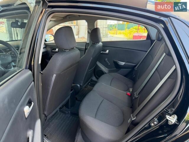 Чорний Кіа Ріо, об'ємом двигуна 1.4 л та пробігом 65 тис. км за 8300 $, фото 4 на Automoto.ua
