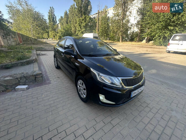 Черный Киа Рио, объемом двигателя 1.4 л и пробегом 182 тыс. км за 5800 $, фото 1 на Automoto.ua