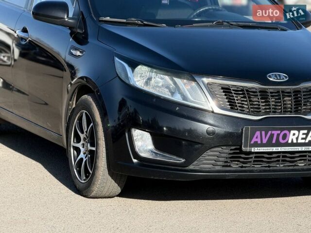 Черный Киа Рио, объемом двигателя 1.4 л и пробегом 162 тыс. км за 7700 $, фото 8 на Automoto.ua