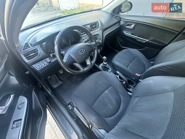 Черный Киа Рио, объемом двигателя 1.4 л и пробегом 182 тыс. км за 5800 $, фото 5 на Automoto.ua