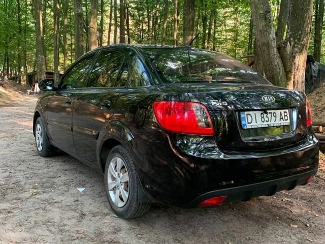 Чорний Кіа Ріо, об'ємом двигуна 1.4 л та пробігом 275 тис. км за 4000 $, фото 3 на Automoto.ua