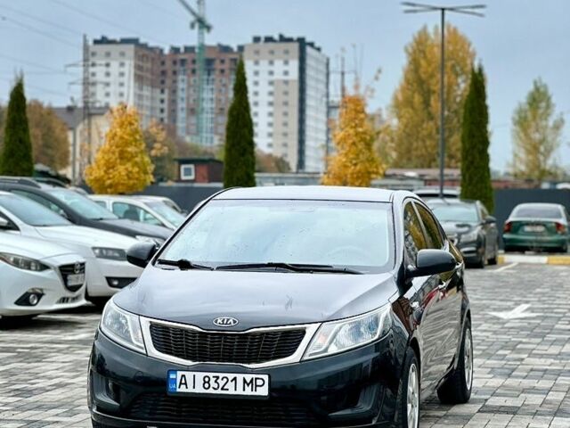 Черный Киа Рио, объемом двигателя 1.4 л и пробегом 180 тыс. км за 5900 $, фото 1 на Automoto.ua
