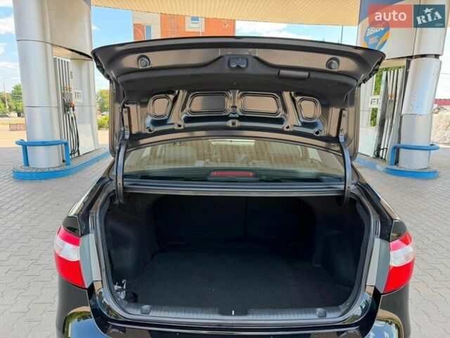 Чорний Кіа Ріо, об'ємом двигуна 1.4 л та пробігом 65 тис. км за 8300 $, фото 9 на Automoto.ua