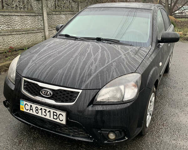 Черный Киа Рио, объемом двигателя 1.4 л и пробегом 105 тыс. км за 4100 $, фото 1 на Automoto.ua