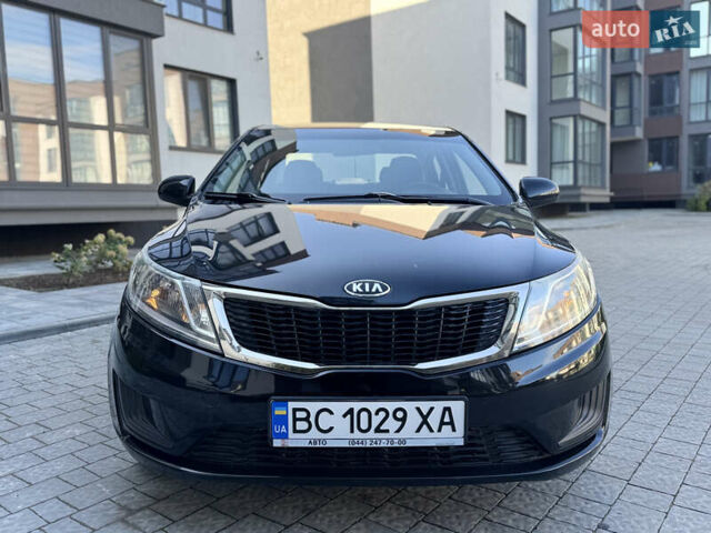Чорний Кіа Ріо, об'ємом двигуна 1.4 л та пробігом 199 тис. км за 5950 $, фото 9 на Automoto.ua