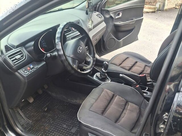 Черный Киа Рио, объемом двигателя 1.4 л и пробегом 197 тыс. км за 7000 $, фото 6 на Automoto.ua