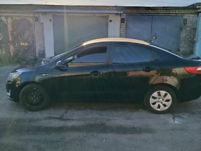 Чорний Кіа Ріо, об'ємом двигуна 1.6 л та пробігом 170 тис. км за 6700 $, фото 2 на Automoto.ua