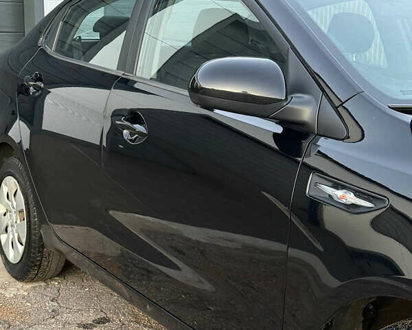 Чорний Кіа Ріо, об'ємом двигуна 1.4 л та пробігом 136 тис. км за 6900 $, фото 4 на Automoto.ua