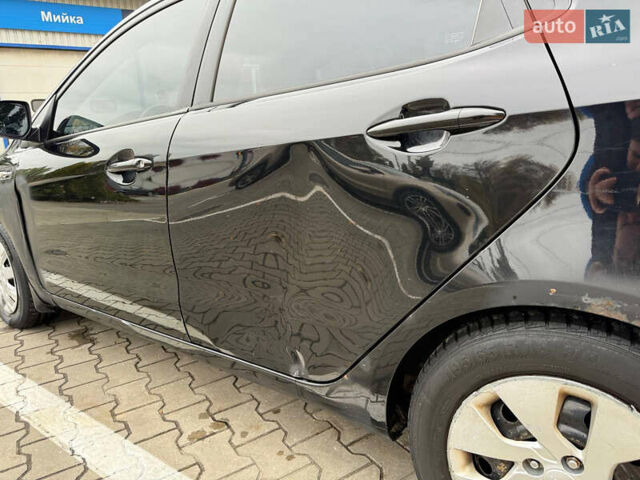 Чорний Кіа Ріо, об'ємом двигуна 1.6 л та пробігом 392 тис. км за 4500 $, фото 4 на Automoto.ua