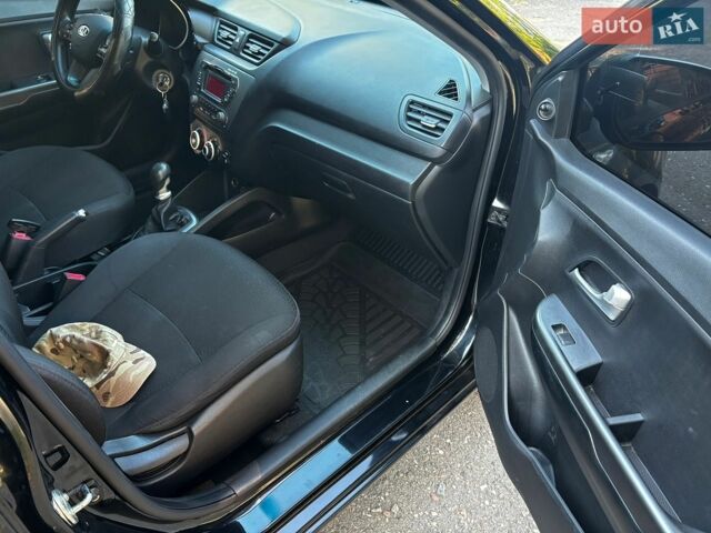 Чорний Кіа Ріо, об'ємом двигуна 1.4 л та пробігом 165 тис. км за 7900 $, фото 31 на Automoto.ua